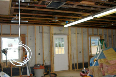 Example of an enclosed light wood floor game room design in Other with red walls