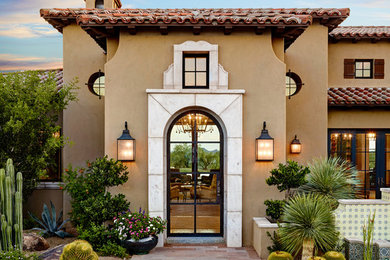 Inspiration for a mediterranean two-storey brown exterior in Los Angeles.