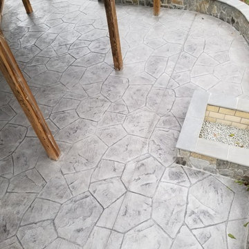 C-Stamped concrete patio with a wall