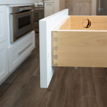Modern White Shaker Kitchen with Oversized Island & Custom Storage Solutions