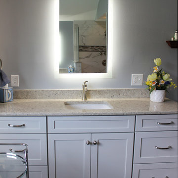Gray Vanity with Freestanding Tub and Tiled Walkin Shower