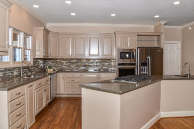 Trendy l-shaped dark wood floor open concept kitchen photo in Other with mosaic tile backsplash, an island and gray countertops