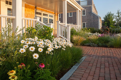 Inspiration for a coastal gray two-story wood gable roof remodel in Boston