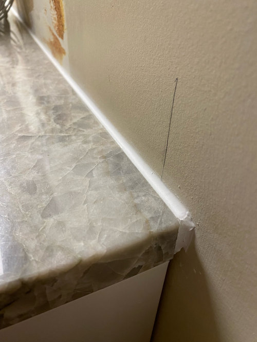 Gap between countertop and wall?