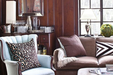 Example of a classic enclosed carpeted and gray floor living room design in New York with a bar, brown walls and no fireplace