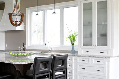 Open concept kitchen - mid-sized transitional l-shaped light wood floor open concept kitchen idea in Toronto with a double-bowl sink, shaker cabinets, white cabinets, granite countertops, an island and stainless steel appliances