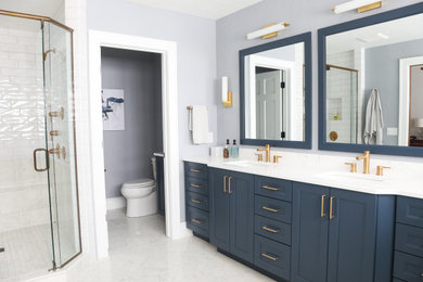 Bathroom - large transitional master marble floor, gray floor and double-sink bathroom idea in Other with flat-panel cabinets, blue cabinets, a two-piece toilet, blue walls, an undermount sink, quartz countertops, a hinged shower door, white countertops and a built-in vanity