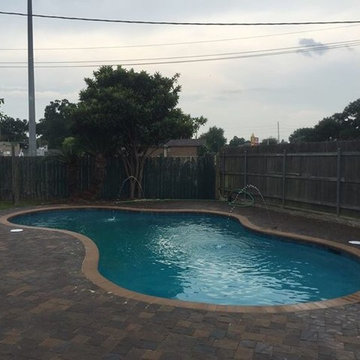 West Bank renovation. Pavestone pavers & coping, midnight blue plaster