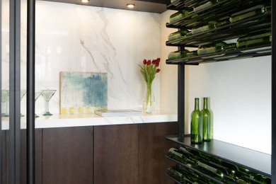 Example of a small 1960s wine cellar design in Orlando with storage racks