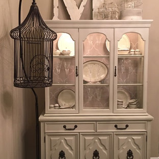 This is an example of a mid-sized traditional open plan dining in Houston with beige walls and porcelain floors.