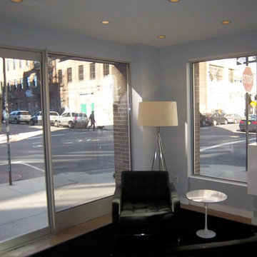 This is a residential lobby, featuring an accent wall [near the elevator].Reside