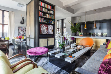 Inspiration for a large contemporary loft-style living room remodel in New York with gray walls and a media wall