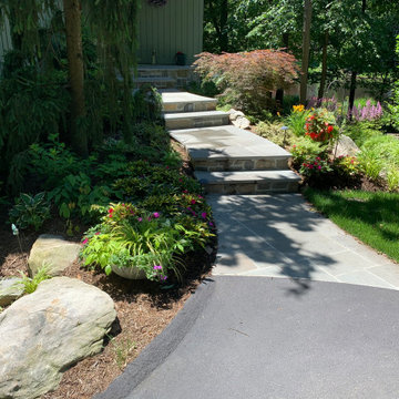 Walkway, retaining walls, plantings and stone stairs and front stoop