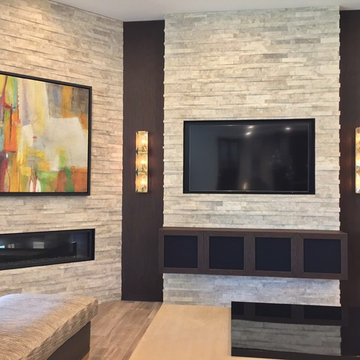 Custom designed pop-out media center houses and inset TV and equipment below.