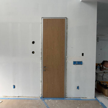 Hidden doors with laminated Walnut