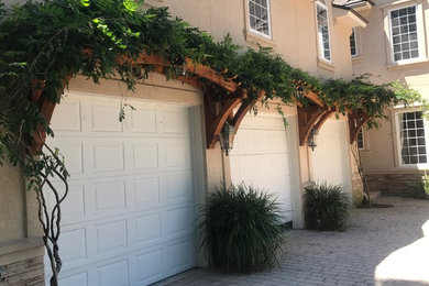 Example of a large classic attached three-car garage design in Jacksonville