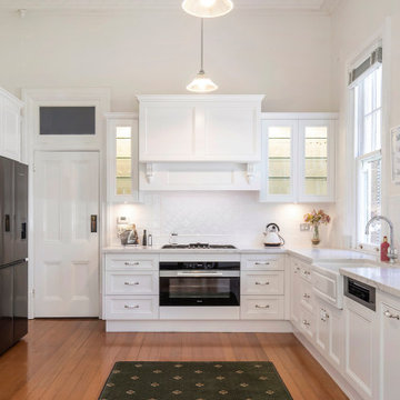 Kitchen with Antique White Milarno Style Doors
