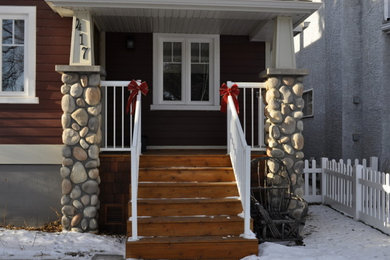 Deck - small craftsman deck idea in Calgary with a roof extension