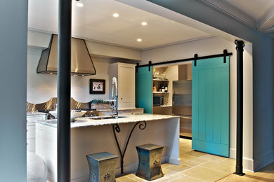 Eat-in kitchen - small modern single-wall concrete floor eat-in kitchen idea in Charlotte with an undermount sink, beaded inset cabinets, white cabinets, metallic backsplash, metal backsplash, stainless steel appliances and an island