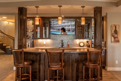 Home bar - large transitional porcelain tile home bar idea in Denver