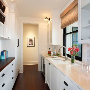 Mid-sized kitchen pantry designs - Mid-sized galley bamboo floor and black floor kitchen pantry photo in Hawaii with an undermount sink, shaker cabinets, white cabinets, marble countertops, white backsplash, marble backsplash, stainless steel appliances and no island
