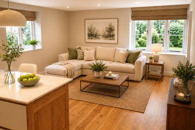 This is an example of a medium sized rural living room in Oxfordshire with medium hardwood flooring and brown floors.