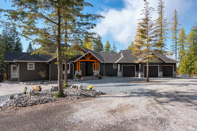 Large craftsman brown two-story concrete fiberboard exterior home idea in Vancouver with a shingle roof