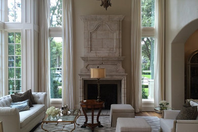 Living room - large traditional formal and enclosed medium tone wood floor living room idea in Dallas with beige walls, a standard fireplace and no tv