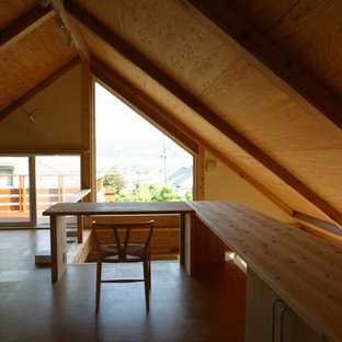 Photo of a modern study in Other with white walls, cork flooring, a built-in desk and brown floors.