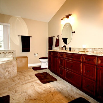 Master Bathroom with Frameless Shower and Jetted Tub