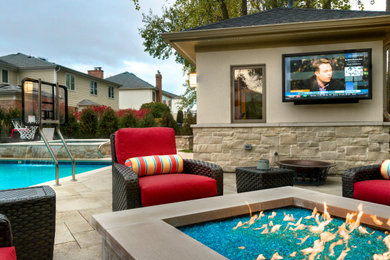 Inspiration for a huge contemporary backyard stone patio remodel with a fire pit and no cover
