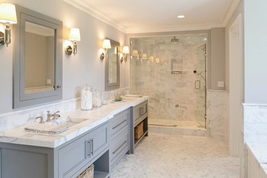 Inspiration for a large contemporary master bathroom in Orange County with recessed-panel cabinets, grey cabinets, an undermount tub, an alcove shower, white tile, matchstick tile, grey walls, marble floors, an undermount sink, marble benchtops, white floor and a hinged shower door.