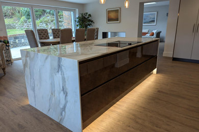 Photo of a large modern kitchen in Hampshire with an island.