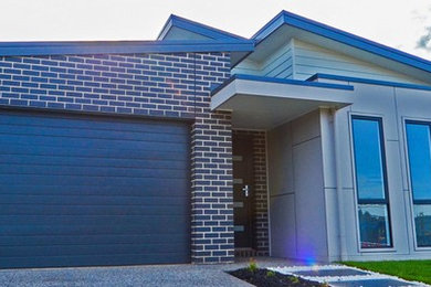 Photo of a contemporary one-storey brick exterior in Geelong.
