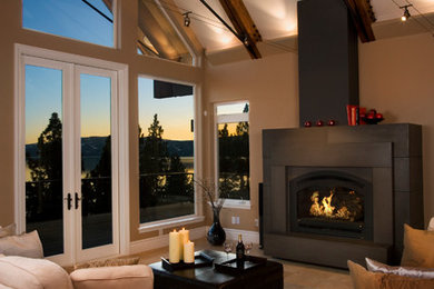Trendy open concept travertine floor living room photo in Sacramento with beige walls and a standard fireplace