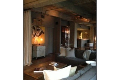 Mid-sized trendy medium tone wood floor living room photo in Houston with gray walls