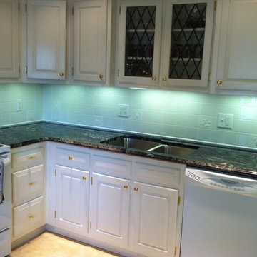 Silver Waves Granite on White Cabinets