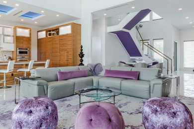 Trendy porcelain tile and white floor living room photo in Tampa with white walls