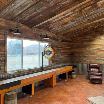 Man Cave- Reclaimed wood walls, rusty metal, barn doors