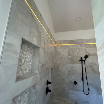 Curd-less walk-in shower; heated floors in bathroom + shower+bench LED