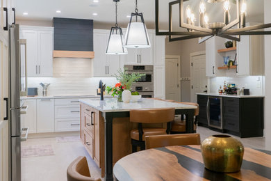 Inspiration for a large transitional l-shaped eat-in kitchen remodel in Other with shaker cabinets, white cabinets, quartz countertops, white backsplash, subway tile backsplash and an island