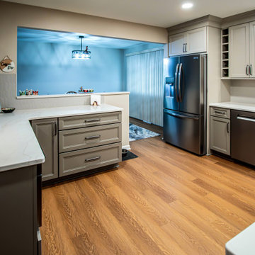 Two-Tone Neutral Kitchen with Quartz Countertop and Soho Picket Backsplash