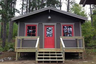 Small mountain style gray one-story wood gable roof photo in Minneapolis