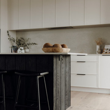 Minimalist Kitchen with Soft Finishes and Dark Island Detail