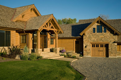 Large mountain style brown wood gable roof photo in Other