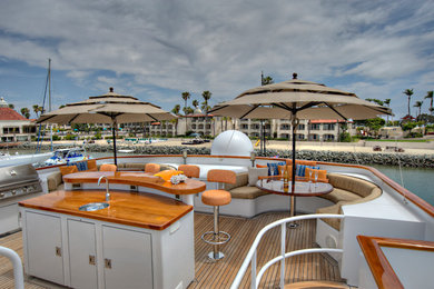 Mid-sized transitional rooftop deck photo in San Diego with no cover