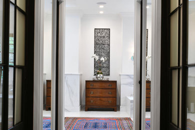 Photo of a mid-sized traditional hallway in Atlanta with medium hardwood floors and multi-coloured walls.