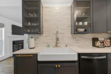 Inspiration for a mid-sized transitional galley medium tone wood floor and brown floor kitchen remodel in Other with a farmhouse sink, shaker cabinets, blue cabinets, quartz countertops, white backsplash, marble backsplash, stainless steel appliances and white countertops