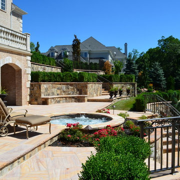 Custom Pools & Spas, Outdoor Kitchens, Patios & Walkways, and Plantings