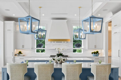 Large beach style kitchen photo in Other with beaded inset cabinets and two islands